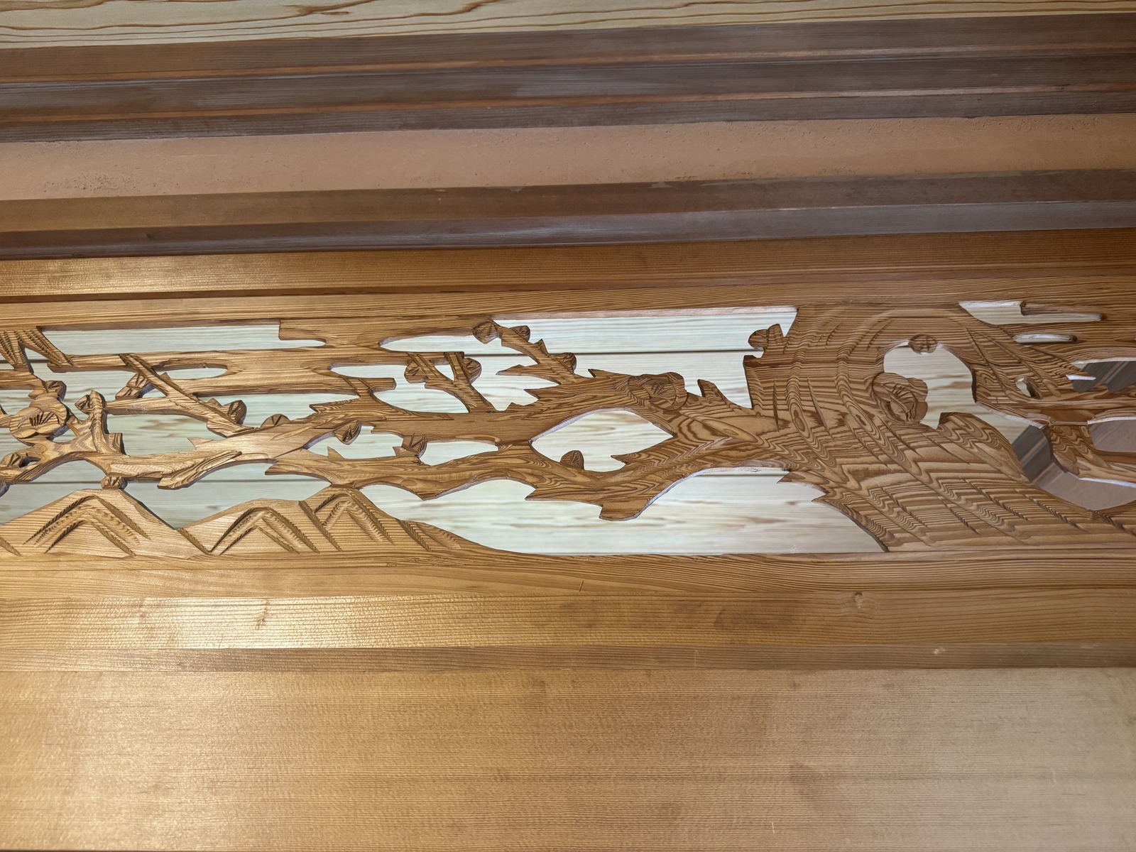 A traditional carved wooden ranma transom preserved at Haku